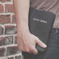 Bible in hand