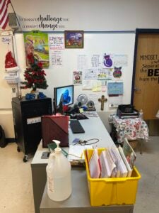 Desk With Crucifix On Wall