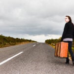 Young Woman With A Suitcase, Choosing Her Own Future, Possibly Running Away From Trouble